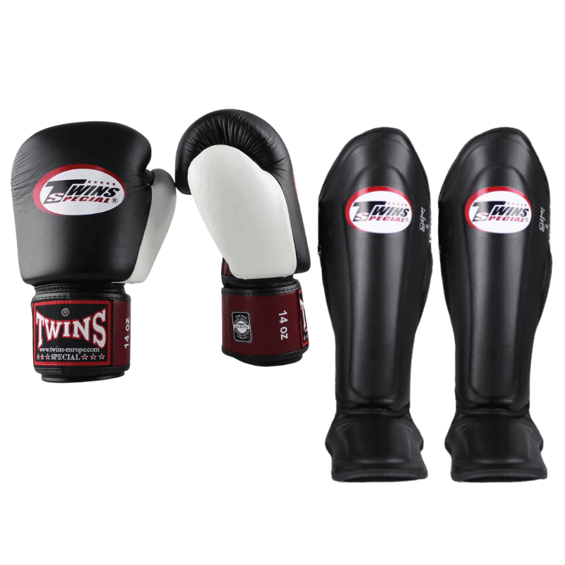 Complete boks set met zwarte en witte Twins bokshandschoenen en scheenbeschermers voor optimale bescherming tijdens vechtsporttraining