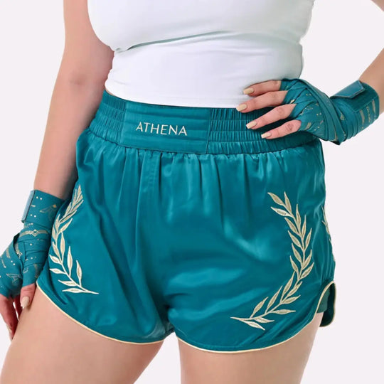 Athena Fightwear teal kickboks shorts met gouden lauwerkrans en brede tailleband voor een comfortabele pasvorm.