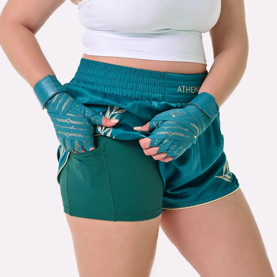Teal Athena Fightwear kickboks shorts met ingebouwde stretchy short en handige zijvakken voor extra ondersteuning.