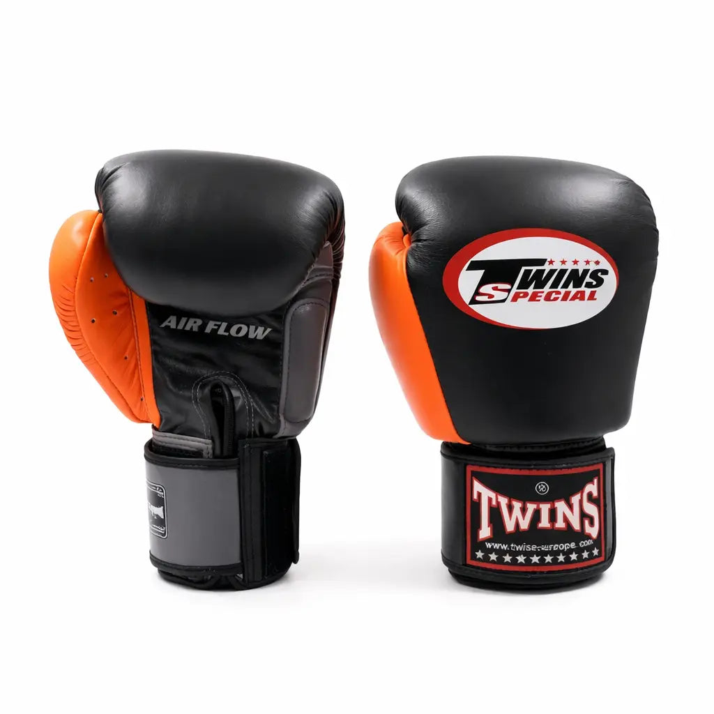 Twins Special bokshandschoenen zwart met oranje padding voor boksen en kickboks training