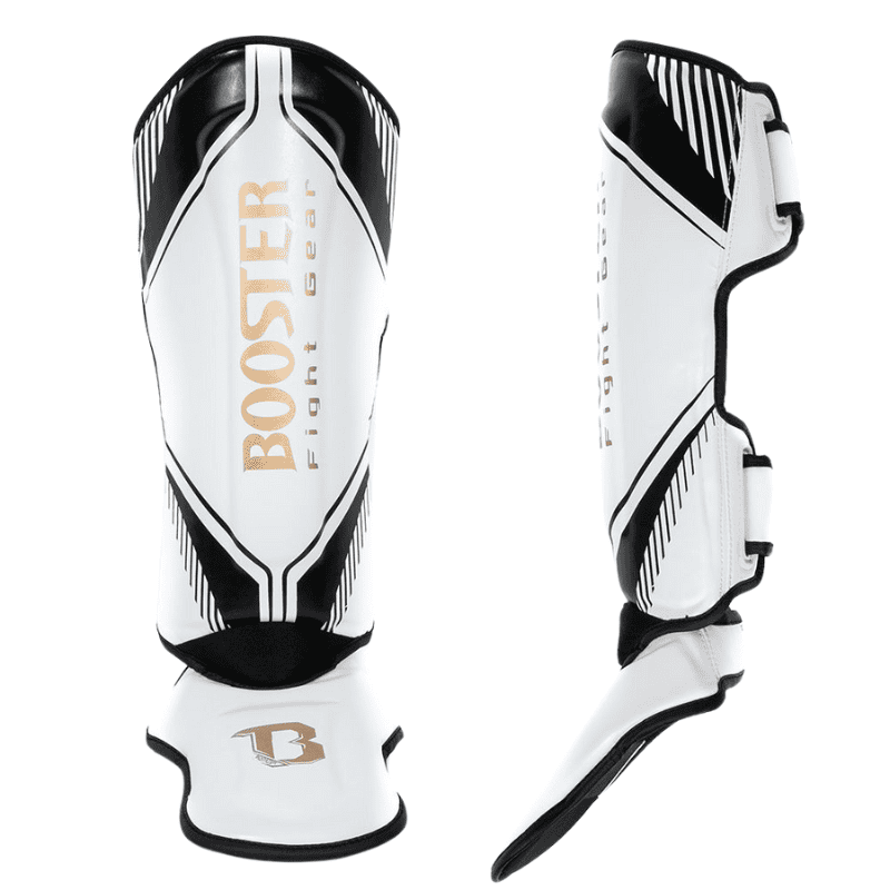 Vooraanzicht en zijaanzicht van een witte Booster scheenbeschermer uit de Bangkok Series, met zwart-witte grafische accenten en goudkleurige merkdetails.