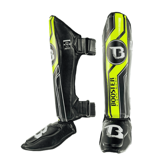 Set Booster Scheenbeschermers BSG V9 in zwart met gele details, ontworpen voor maximale bescherming, stevige pasvorm en duurzaamheid tijdens kickbokstrainingen.