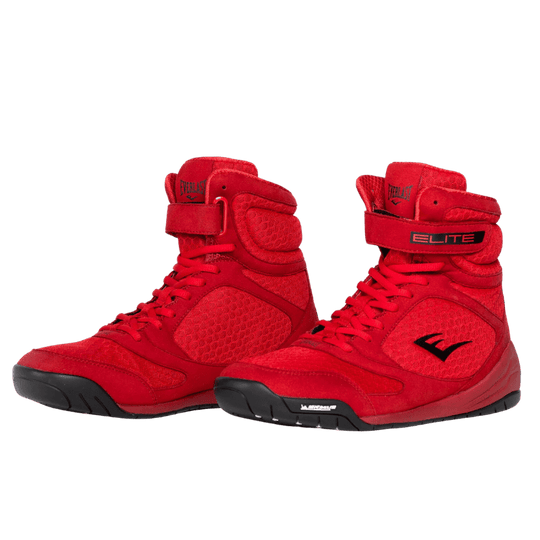 Een paar rode Elite 2 boksschoenen, schuin van voren weergegeven, met een robuuste constructie en een Michelin-buitenzool voor grip en duurzaamheid.