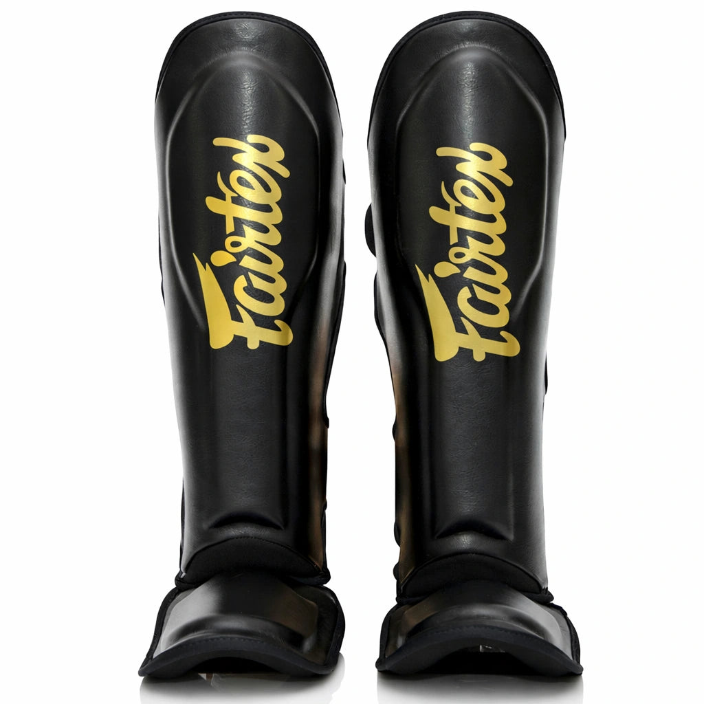 Fairtex scheenbeschermers zwart goud voor kickboksen en Muay Thai met maximale bescherming
