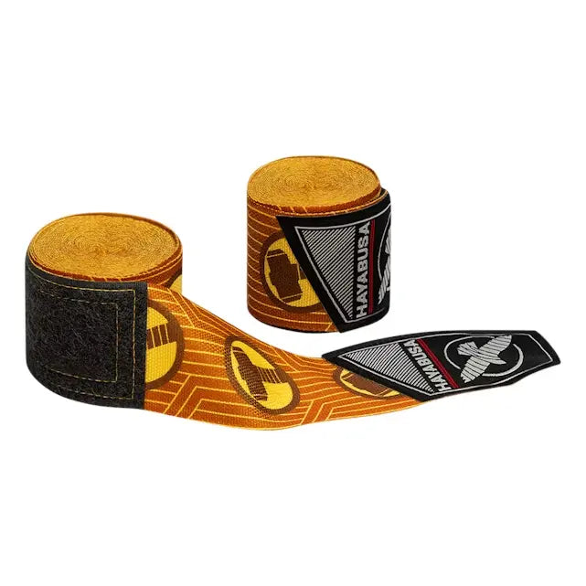 Oranje Hayabusa bandages met zwart-wit logo en Thor-hamer symbolen, deels uitgerold en gepresenteerd op witte achtergrond.