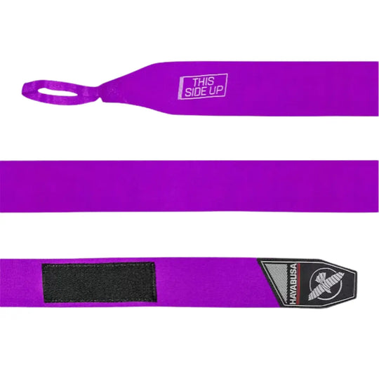Uitgerolde paarse Hayabusa Perfect Stretch bandage met duimlus, “This Side Up”-markering en zwart klittenband, duidelijk zichtbaar op een witte achtergrond voor productweergave.