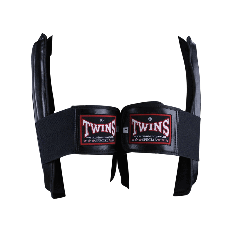 Close-up van de klittenbandsluiting van de Twins Special beenbeschermers, toont hoe de beschermer stevig kan worden vastgemaakt voor een veilige en comfortabele pasvorm.