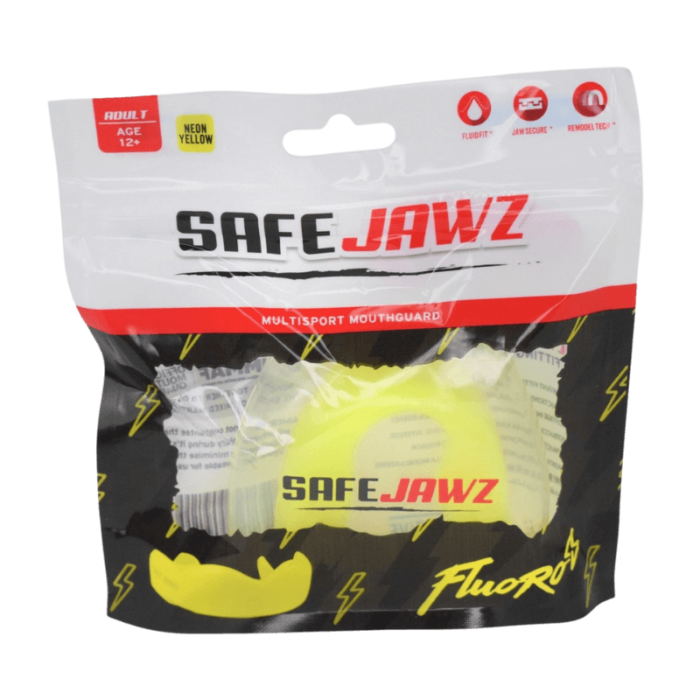 Verpakking van een neon gele SafeJawz mondbeschermer met 'FluoRyte' design, zichtbaar door het doorzichtige deel van de zwarte verpakking.