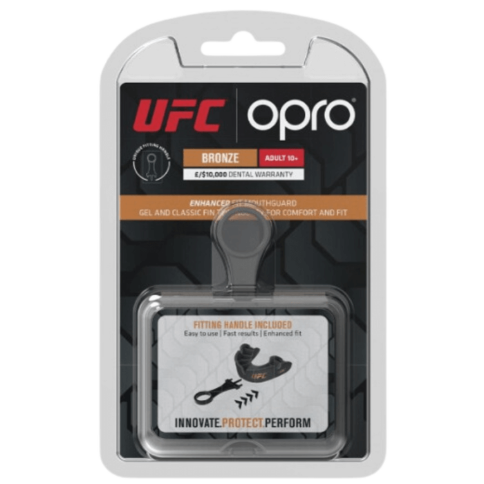 Verpakking van een Opro UFC bronzen mondbeschermer, geschikt voor volwassenen, met een tandheelkundige garantie en compressiehulpmiddel.